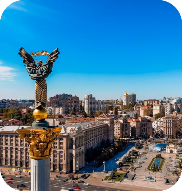 A bird's eye view of a city with a statue.